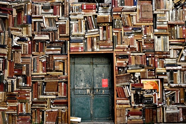 Walls of books surrounding a door