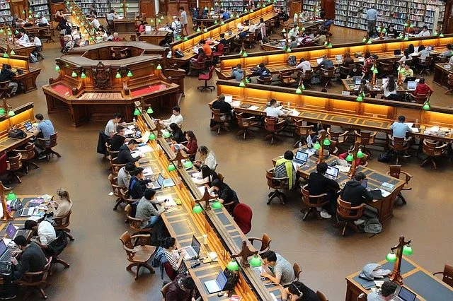 Many people studying in a library